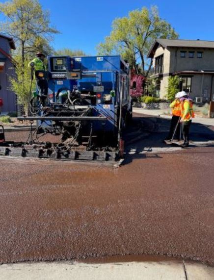 Slurry Seal workers on a city street