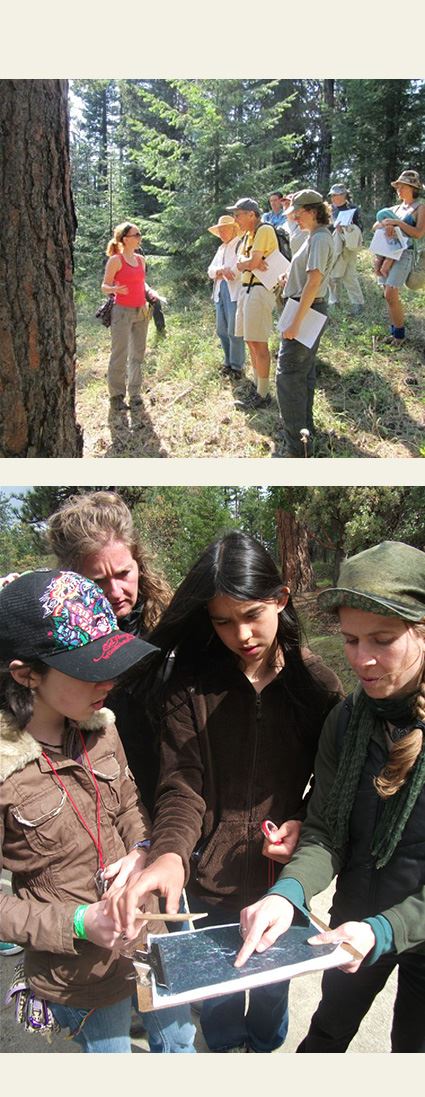 a group of people at an outdoor class; people outdoors looking at a map on a clipboard