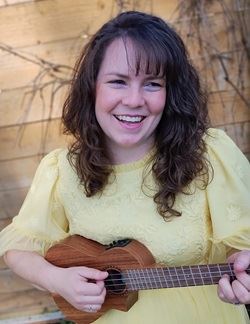 Glory Salinas Nylander, woman playing a ukulele. 
